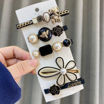Black and gold hair clip set nz