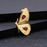 Gold butterfly necklace with garnet nz