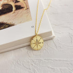 Gold compass pendant nz