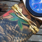 Gold steel bangle Or nz