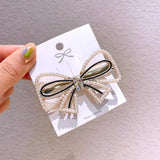 Pearl bow hair clip nz