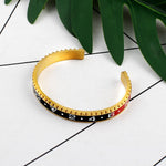 Sports bangle Gold and black / 62 mm nz