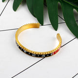 Sports bangle Gold and black / 62 mm nz